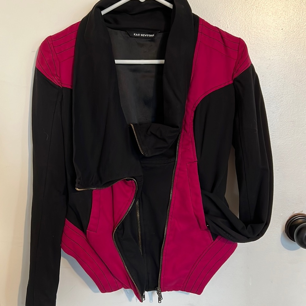 Faux suede pink and black jacket size xs, has double zippers. Lightly used.